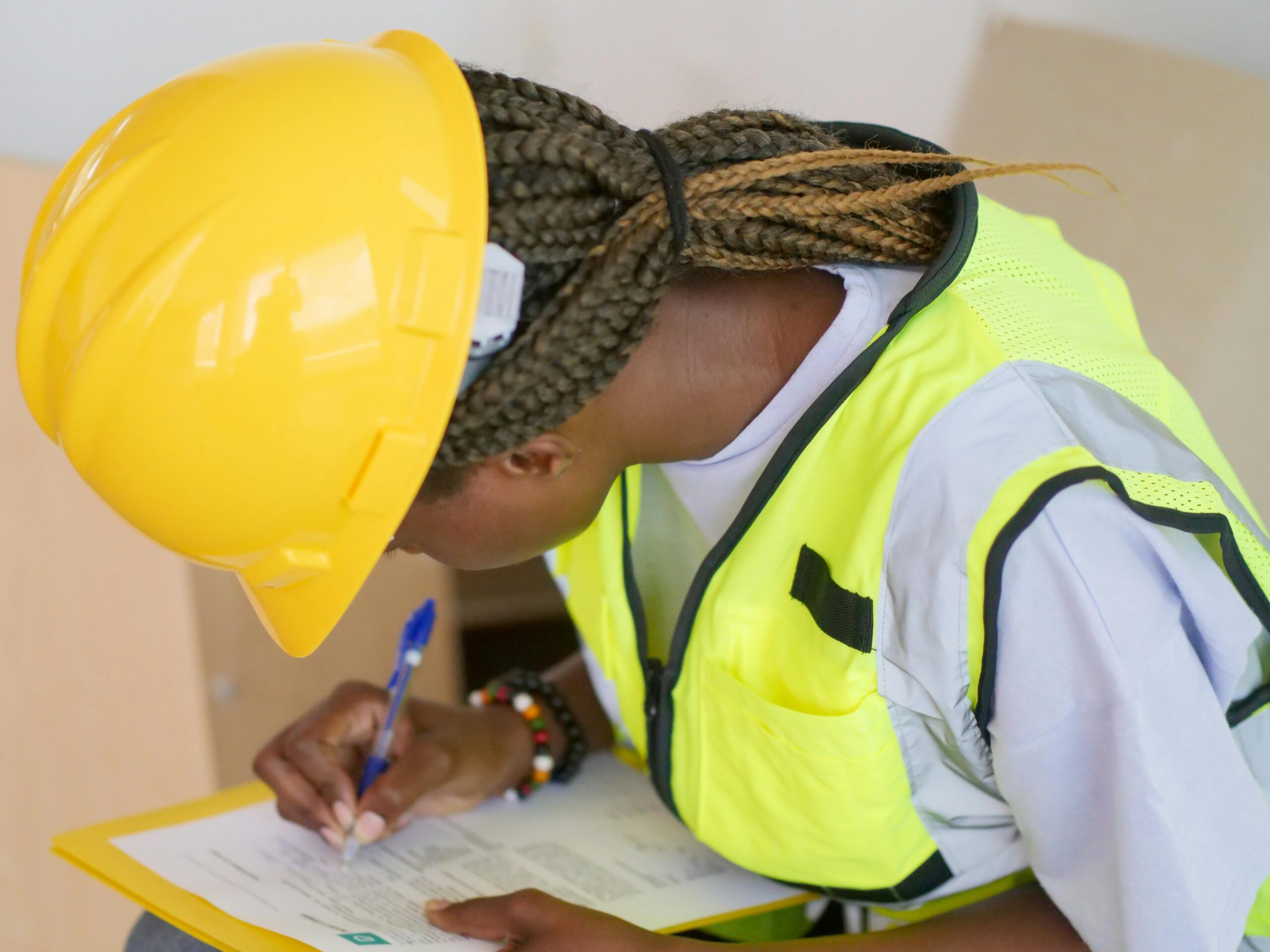 Photo by Kindel Media: https://www.pexels.com/photo/woman-engineer-writing-down-on-paper-8488032/