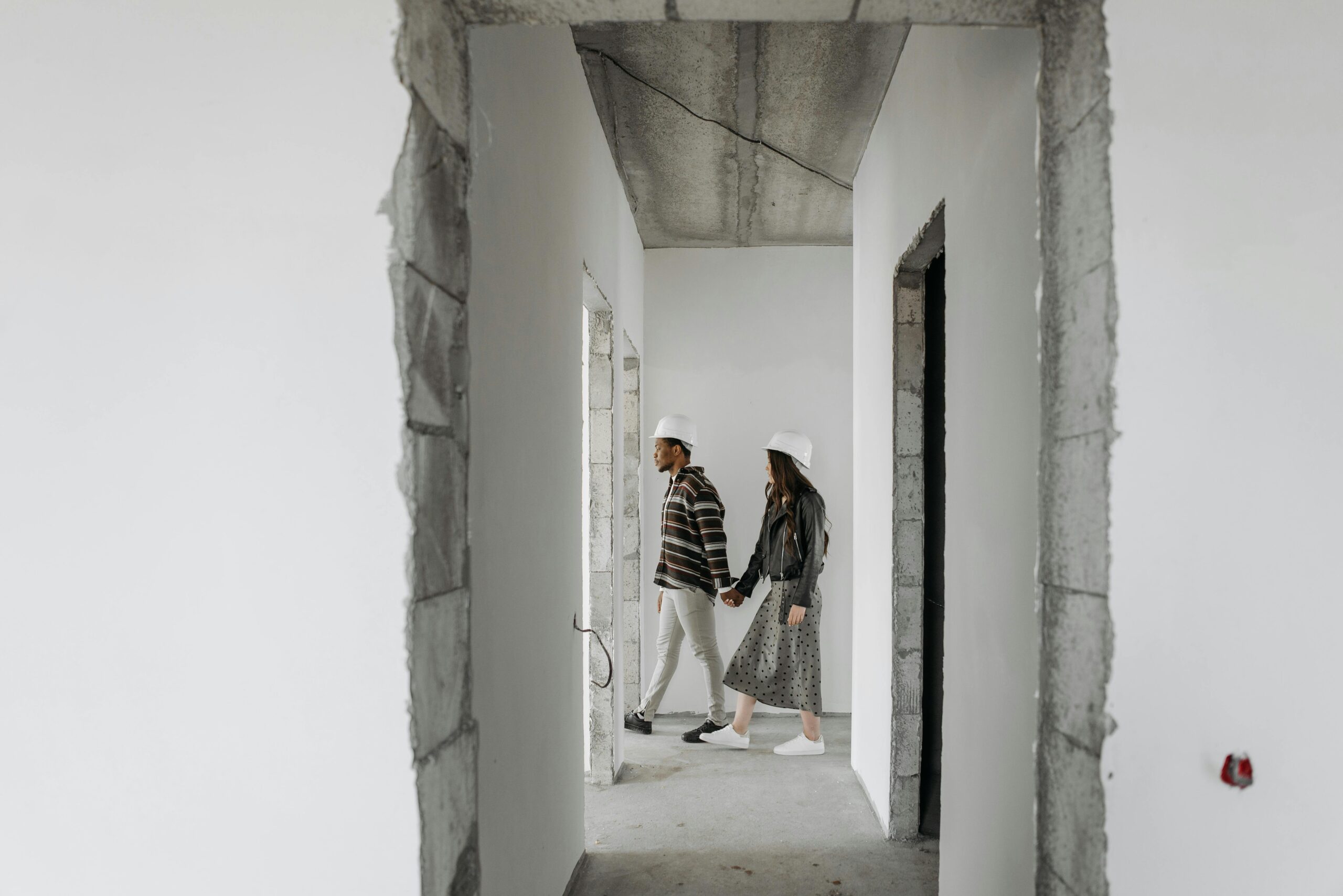 Photo by Pavel Danilyuk: https://www.pexels.com/photo/a-couple-wearing-hard-hat-touring-inside-the-unfinished-house-7937706/